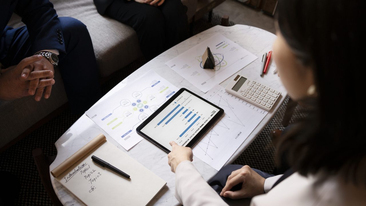 business-people-working-with-ipad-high-angle